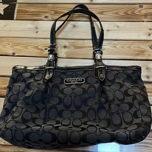 Used Coach bag fair condition. Some wear staining on interior 12”x 6” in size.